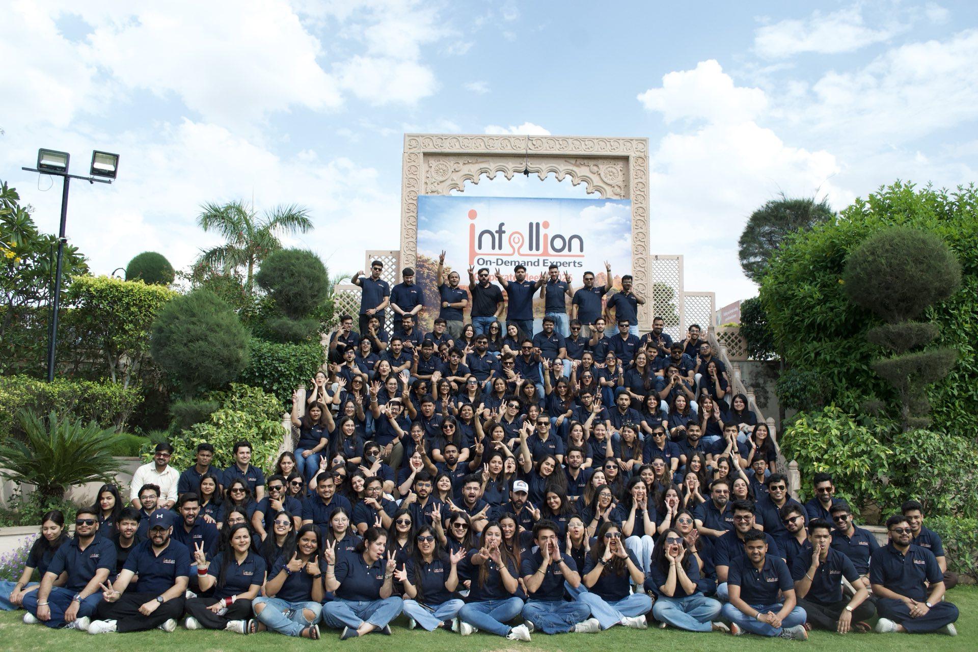 The Infollion team gathered together in branded polo shirts at the company's annual Corporate Meet.